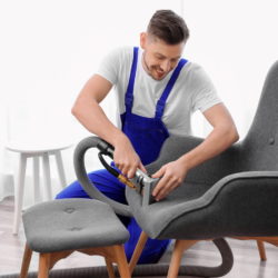 service-texh-cleaning-chair-lossy Cleaning Technician Performing Upholstery Cleaning Service On A Chair